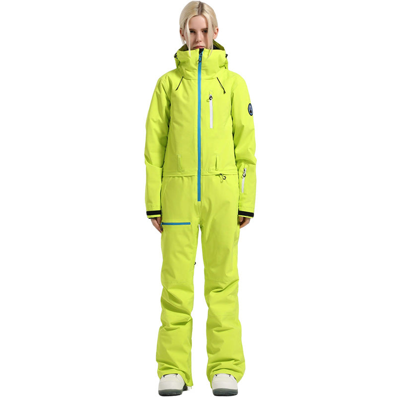 Full-length front view of a model wearing the neon yellow Alpine Access one-piece ski suit with blue zipper trim.