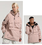 Two models wearing the pink Range pullover snow jacket, showing its relaxed silhouette and front pockets.
