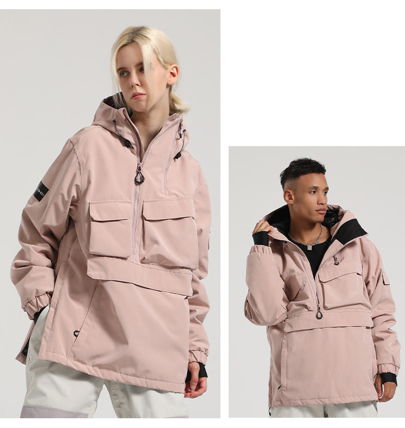 Two models wearing the pink Range pullover snow jacket, showing its relaxed silhouette and front pockets.