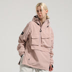 Model wearing the pink Range pullover snow jacket, showing the chest pockets and side zipper opening.